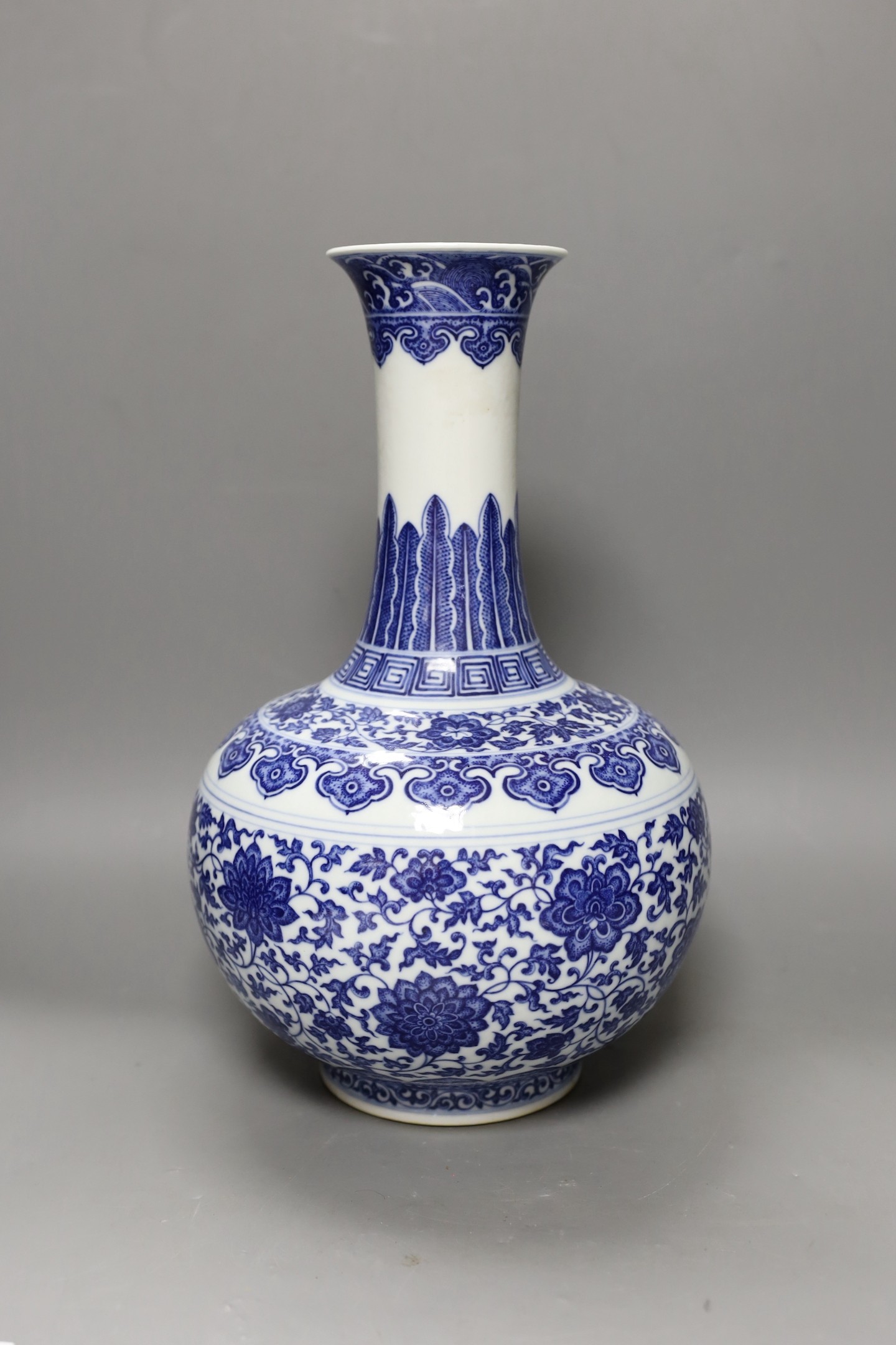 A Chinese blue and white bottle vase, Qianlong seal mark, 37cms high